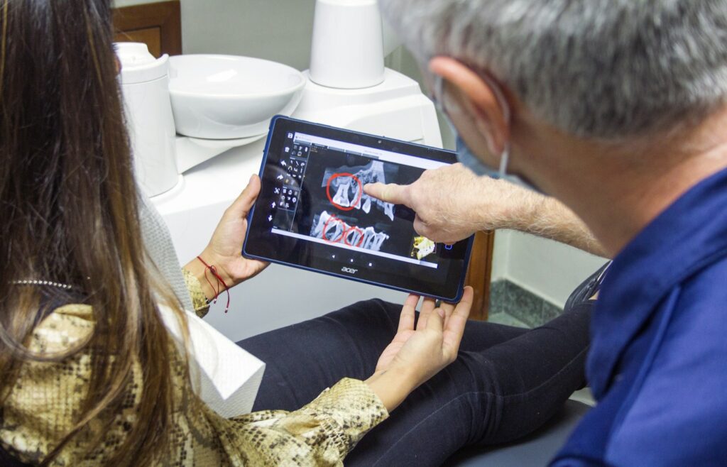 Dentist explaining a dental scan to a patient
