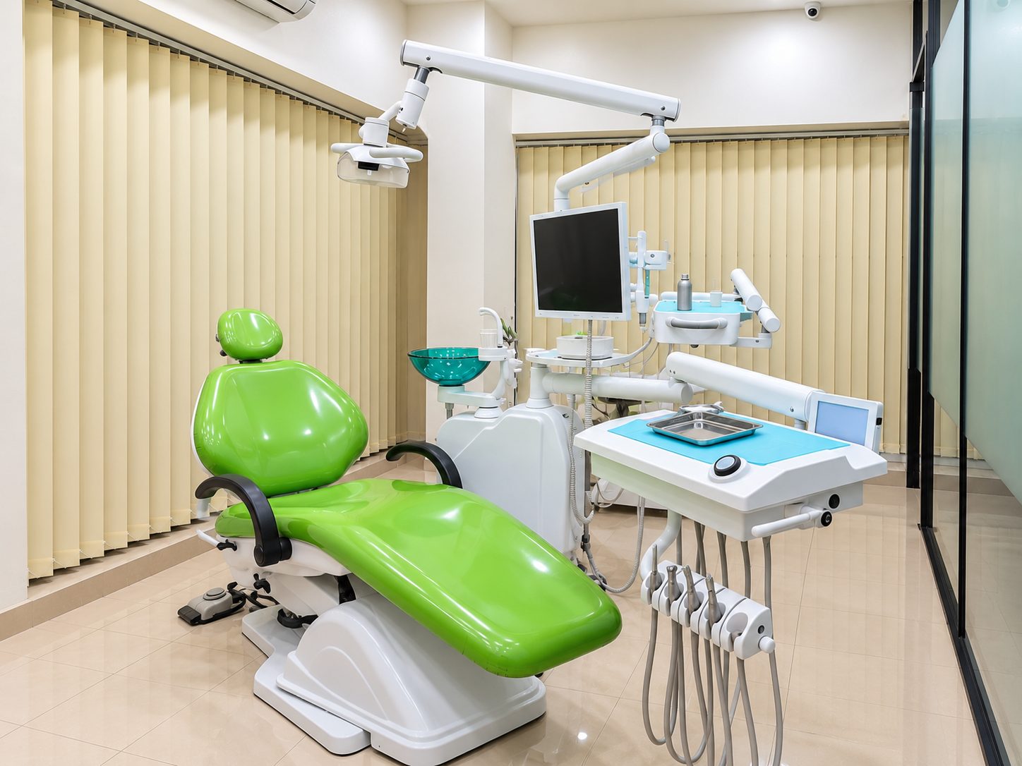 Treatment room with dental chair at Yashodhar Dental Clinic
